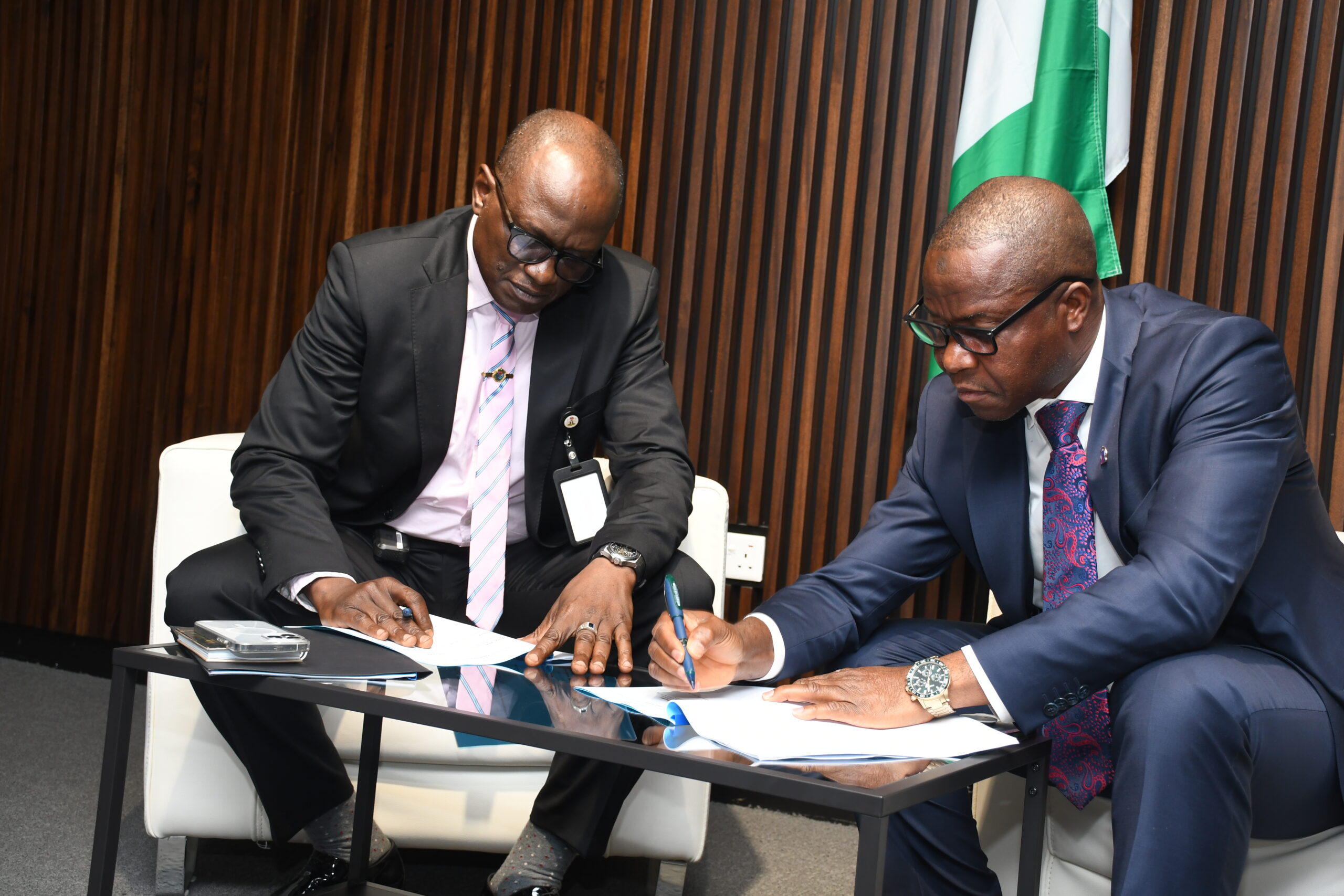 New National Coordinator, Maj. Gen. Adamu G. Laka (Left) and the immediate past National Coordinator, Retired Rear Admiral Yaminu Musa (right), signing the handover document.