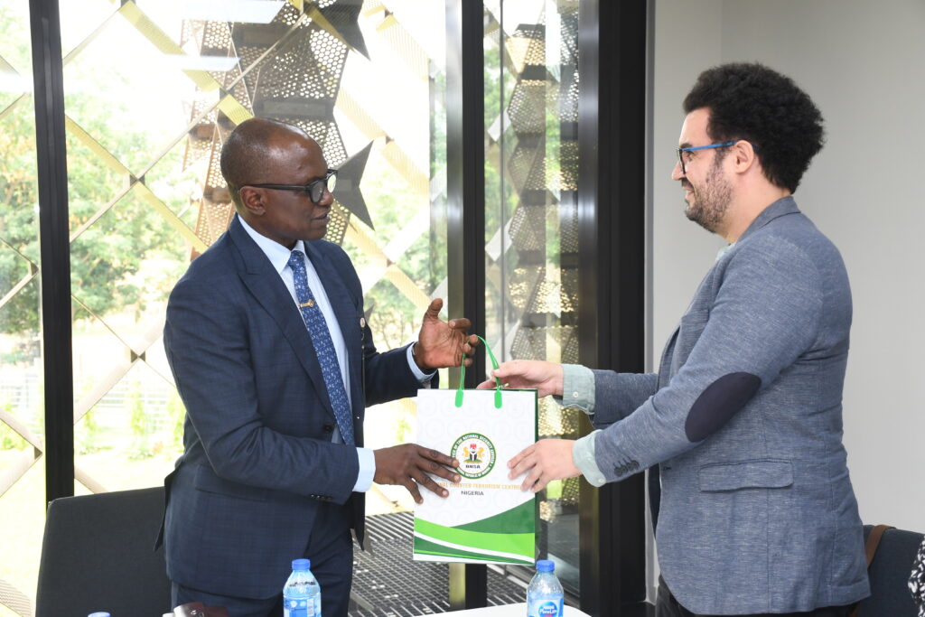The National Coordinator, NCTC (Left) Presenting a souvenir to the Country Manager, GCERF, Mikael Amal at the event