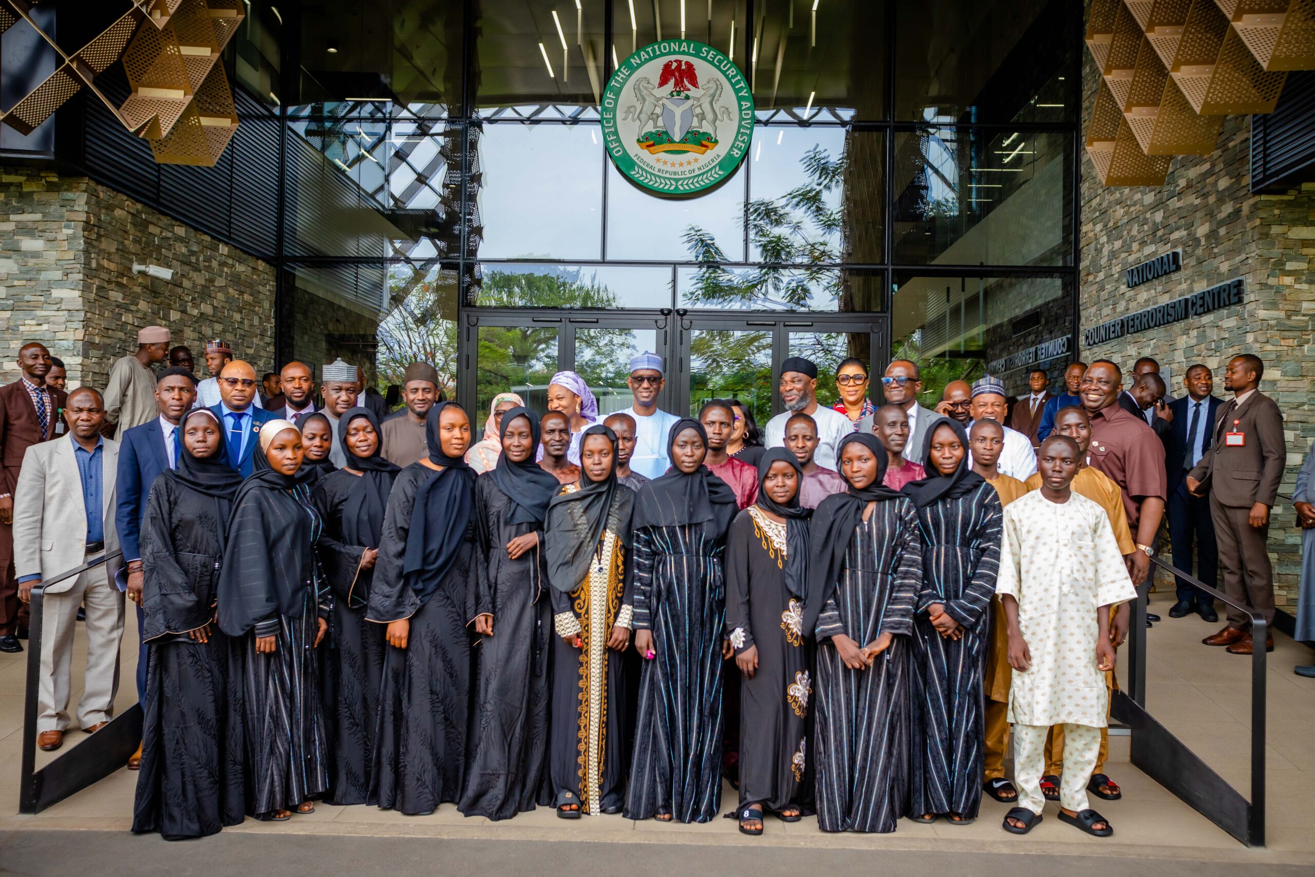 NSA, Reps of the Senate Cttee National Security and Intelligence, Senior Management Staff of the ONSA and the recued Students and others in a group photograph on Monday